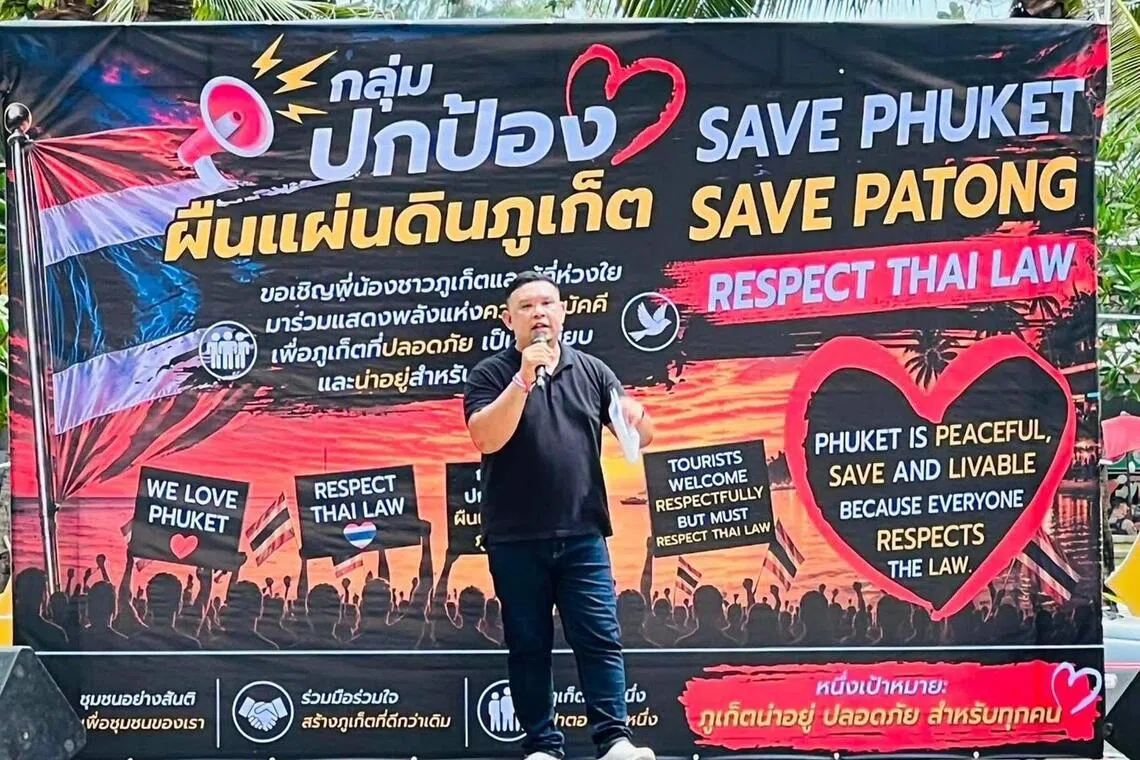 A speaker at The “Save Phuket” event at Patong Beach, Phuket on Aug 28.