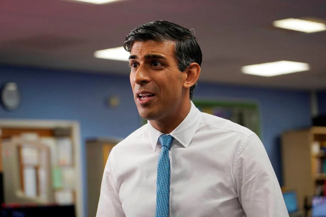 Britain's Prime Minister Rishi Sunak answers to reporters after meeting students at a school in London, Monday, July 17, 2023.     Alberto Pezzali/Pool via REUTERS