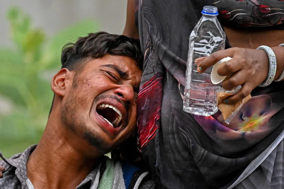 A family member mourning the death of his 14-year-old brother, who was sleeping on the ground when Air India flight 171 crashed in a residential area, at the hospital mortuary in Ahmedabad, on June 13, 2025. 