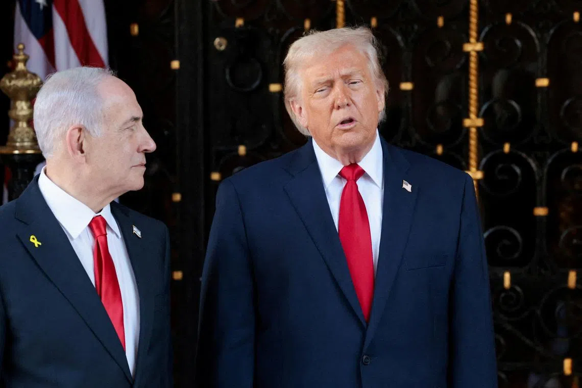 U.S. President Donald Trump speaks next to Israeli Prime Minister Benjamin Netanyahu upon arrival for meetings at Trump's Mar-a-Lago club in Palm Beach, Florida, U.S., December 29, 2025. REUTERS/Jonathan Ernst