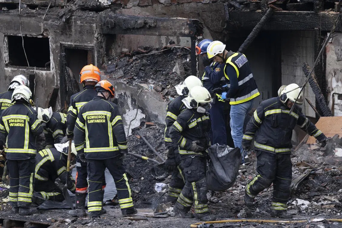 Emergency services working at the site of the blast in Santander, northern Spain, on Oct 26.