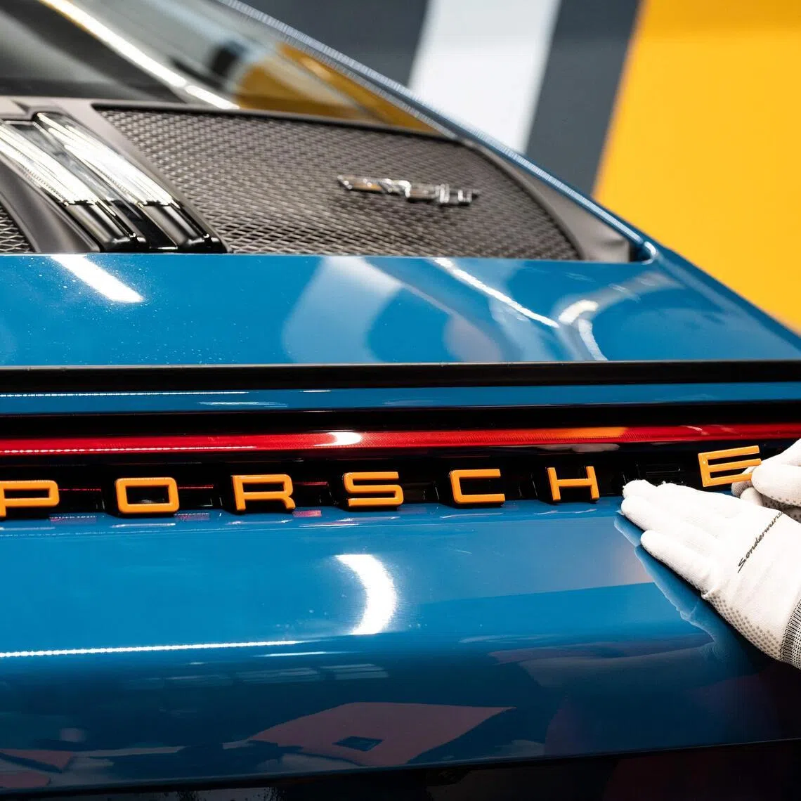 The agreement underscores the mounting pressure across Porsche parent Volkswagen.