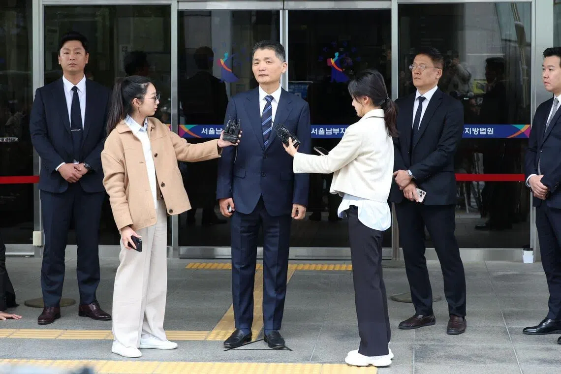 Kakao Corp founder Kim Beom Su speaks to the media as he leaves the Southern District Court in Seoul, South Korea.