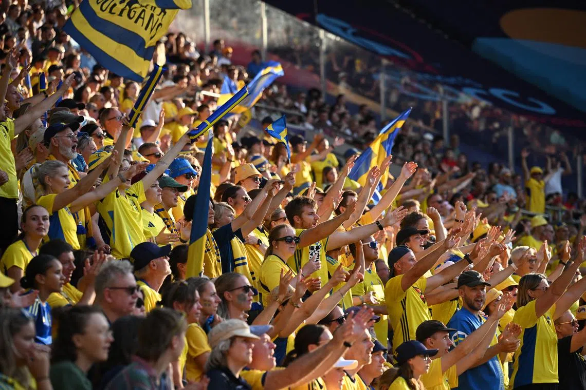 Heat wilts players but not fans' spirit at Sweden-Denmark Euros clash ...