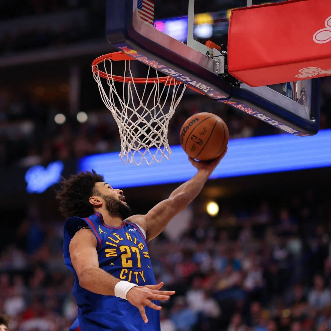 Jamal Murray of the Denver Nuggets scores against Toumani Camara of the Portland Trail Blazers during the fourth quarter at Ball Arena.