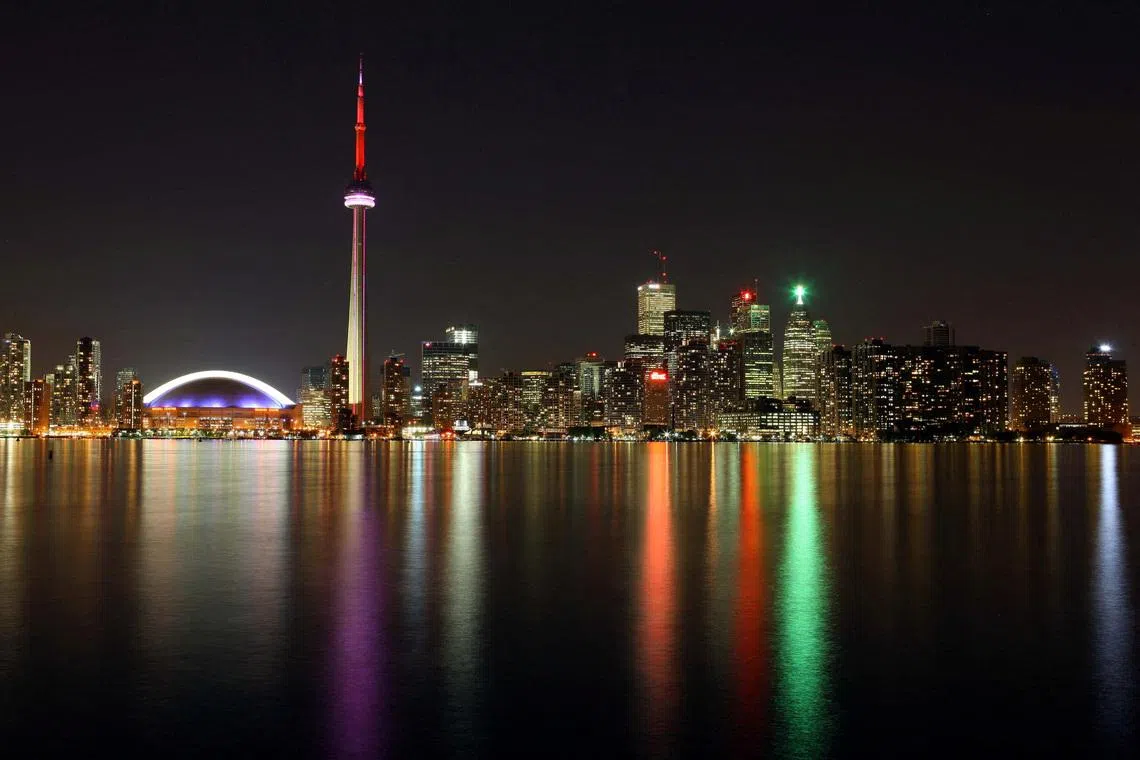June 24, 2009; Toronto, ON, Canada; A view of the Rogers Centre next to the CN Tower and the rest of the Toronto skyline as seen across Lake Ontario. Mandatory Credit: Tom Szczerbowski-US PRESSWIRE