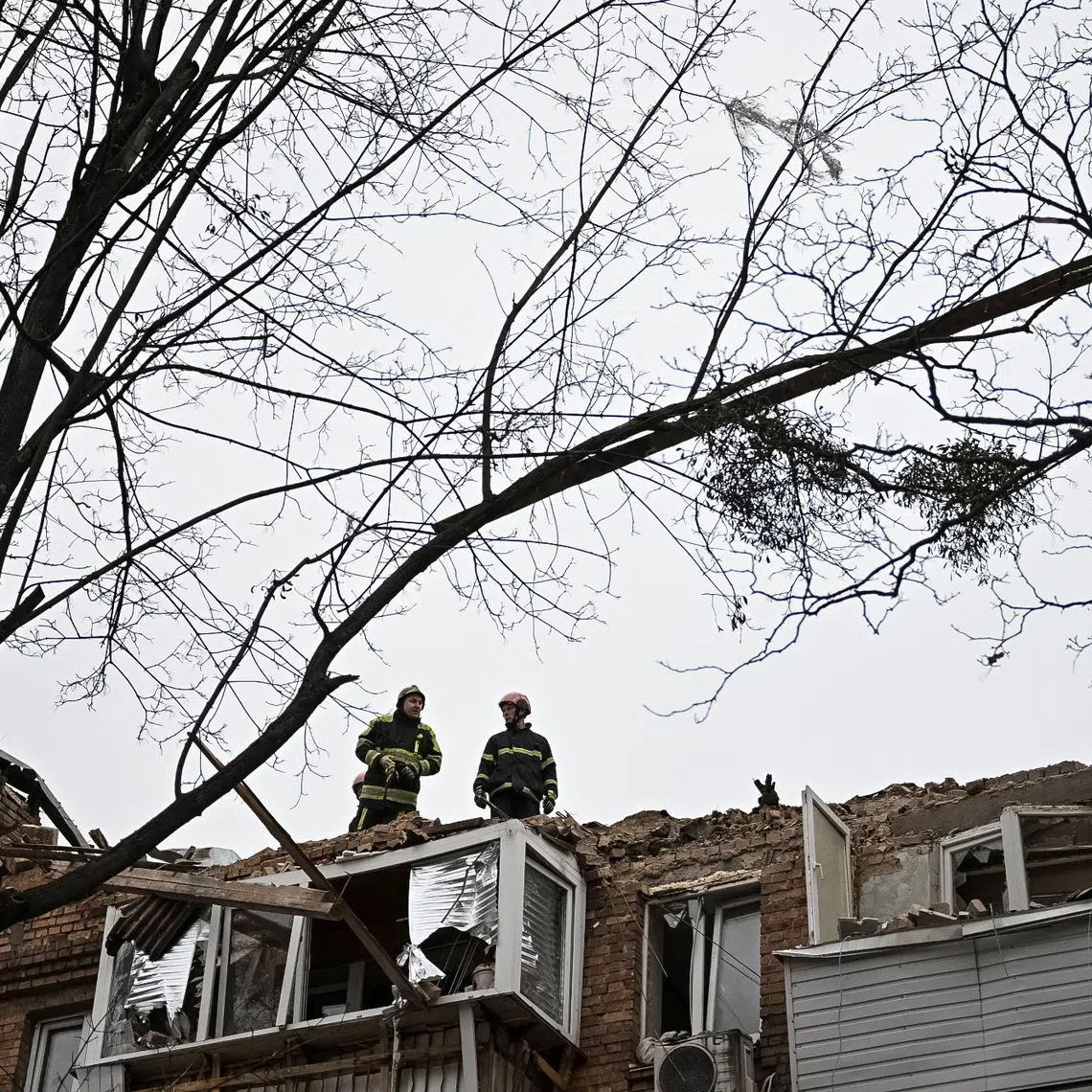 Rescuers work at the site of the apartment building hit by a Russian drone during a Russian missile and drone strike, amid Russia's attack on Ukraine, in Kyiv, Ukraine December 27, 2025. REUTERS/Viacheslav Ratynskyi
