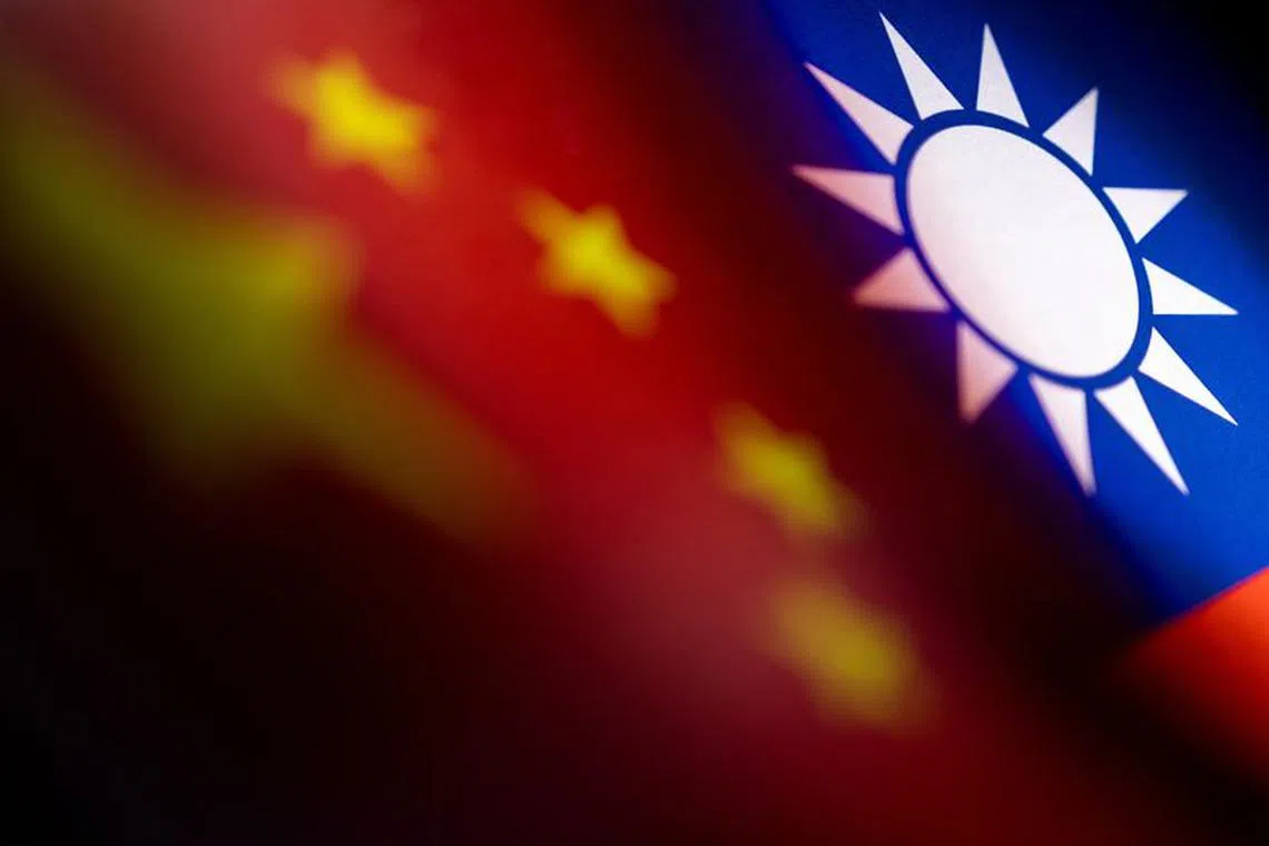 Chinese and Taiwanese printed flags are seen in this illustration taken, April 28, 2022. Picture taken April 28, 2022.  REUTERS/Dado Ruvic/Illustration