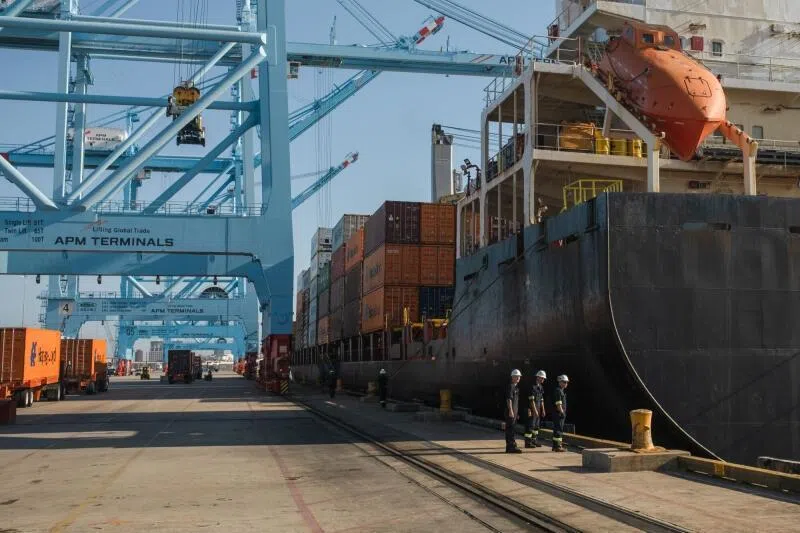 A crew inspecting the Maersk Nansha, a docked container ship, at APM Terminals inside the Port of Mobile in Mobile, Alabama, USA.