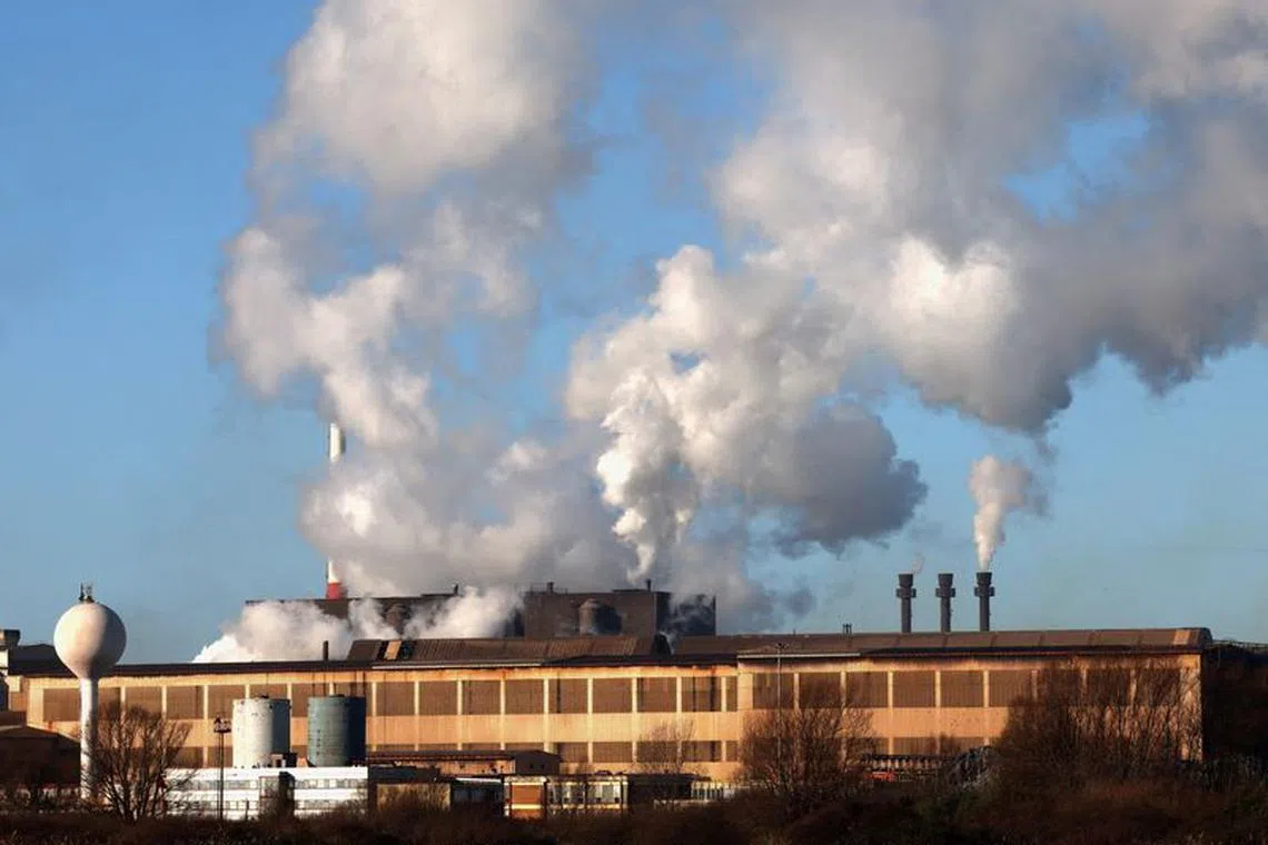 Smoke rises from chimneys at a factory in the port of Dunkirk, France  January 19, 2023. REUTERS/Yves Herman/File photo
