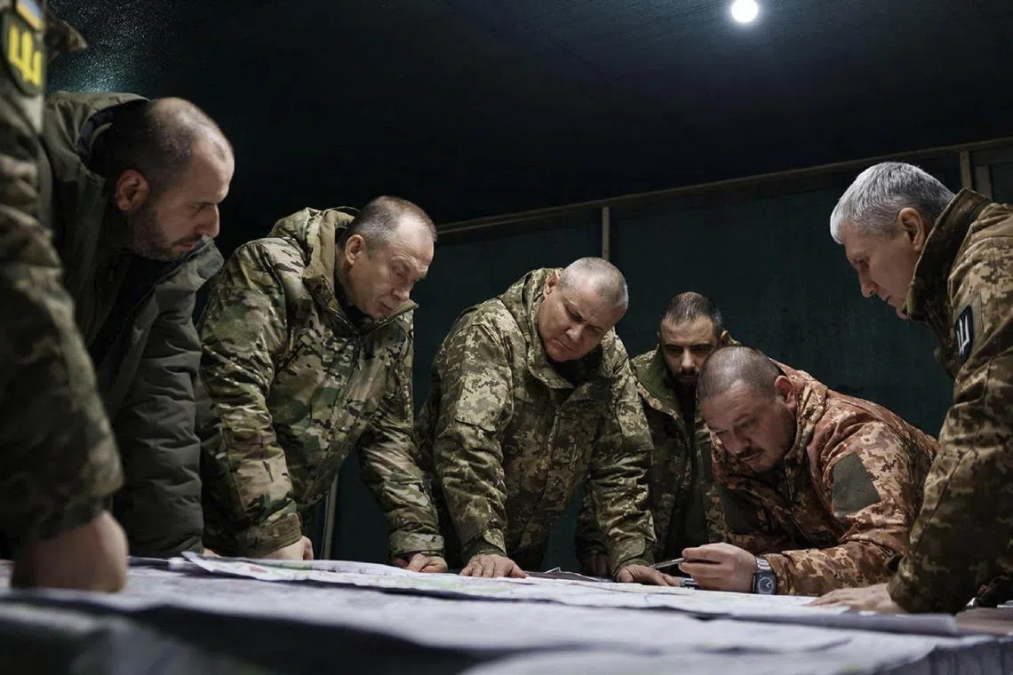 Commander-in-Chief of the Armed Forces of Ukraine Oleksandr Syrsky (second from left) and Ukraine's Defence Minister Rustem Umerov (left) visiting front-line positions in eastern Ukraine. 