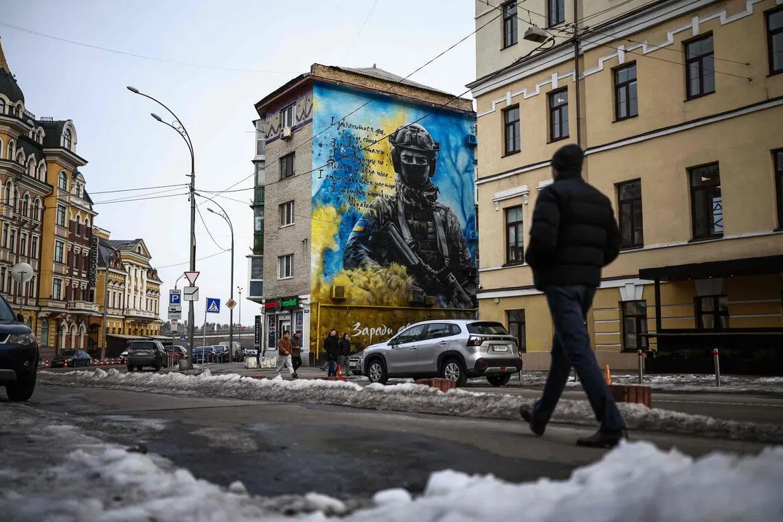 Street art in Ukraine's capital, Kyiv, on Feb 27, depicting a Ukrainian soldier with the colours of the Ukrainian flag, amid Russia's four-year invasion of the country.