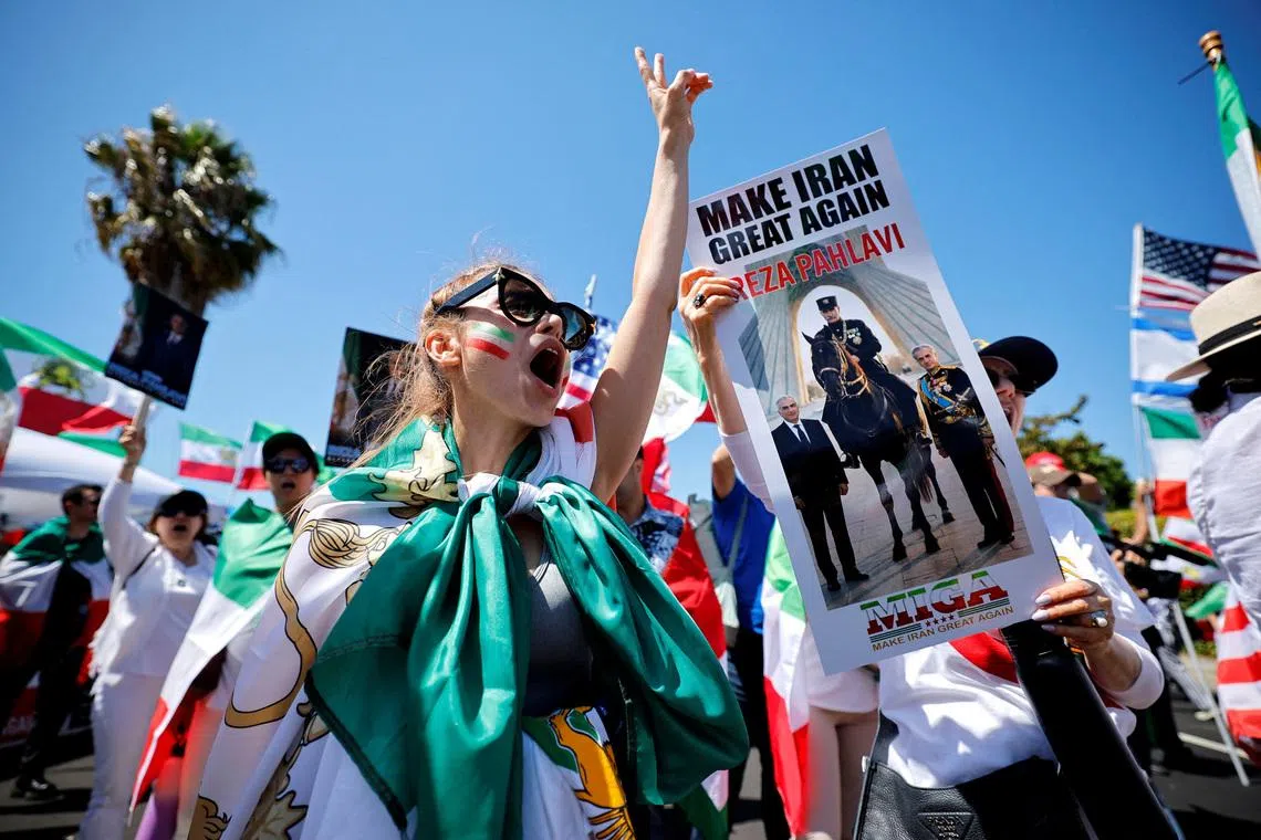 Soccer Football - FIFA World Cup 2026 - Group G - Iran v New Zealand - Los Angeles Stadium, Inglewood, California, U.S. - June 15, 2026 Protesters with Iran flags and banners of Iranian political activist Reza Pahlavi outside the stadium REUTERS/Mike Blake