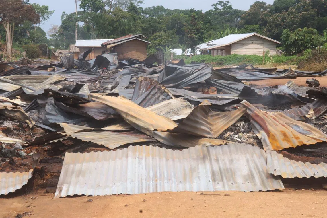 FILE PHOTO: The ruins of market stalls smoulder following an attack by suspected Islamist rebels from the Allied Democratic Forces (ADF), within Masala village in Beni territory of eastern Democratic Republic of Congo June 9, 2024. REUTERS/Gradel Muyisa Mumbere/File Photo