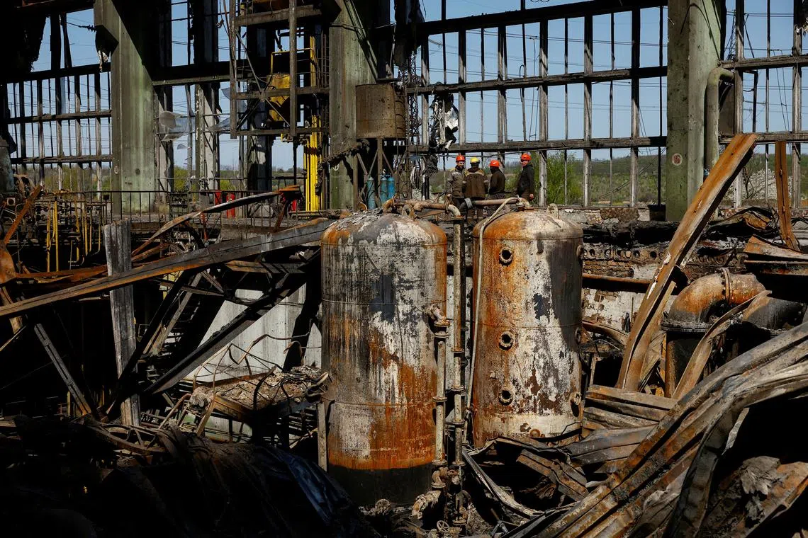 FILE PHOTO: Employee work at a thermal power plant heavily damaged by recent Russian missile strikes, amid Russia's attack on Ukraine, in an undisclosed location in Ukraine April 12, 2024. REUTERS/Valentyn Ogirenko/File Photo