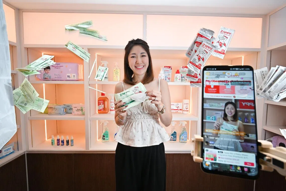 Homemaker Emily Tan conducts daily morning live streams, before going about her mum duties.