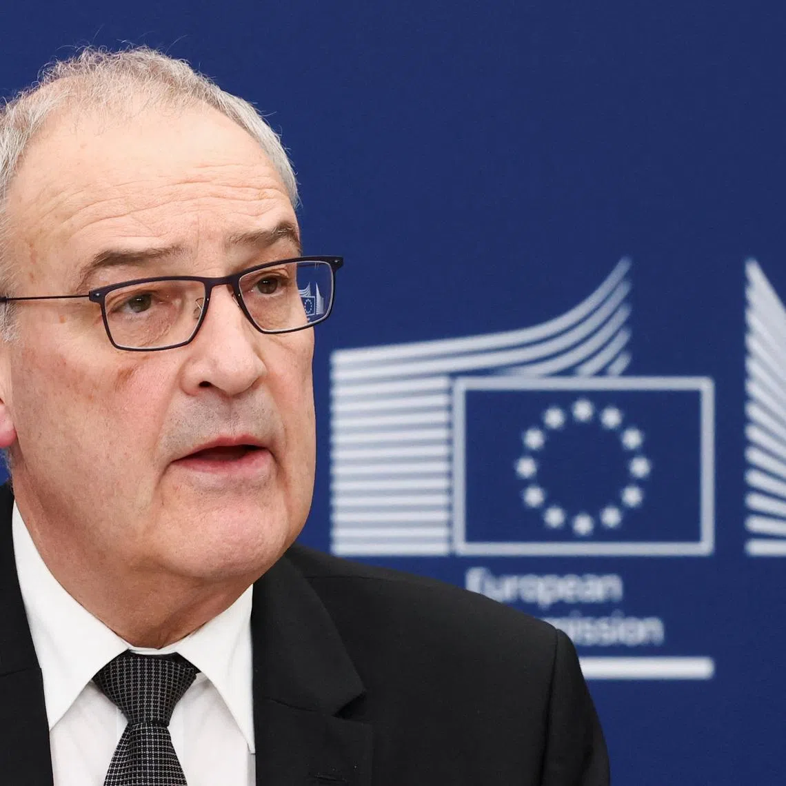 FILE PHOTO: President of the Swiss Federation, Guy Parmelin, speaks next to European Commission President Ursula von der Leyen (not pictured), ahead of the signing of a broad package of EU-Switzerland agreements, in Brussels, Belgium, March 2, 2026. REUTERS/Yves Herman/File Photo