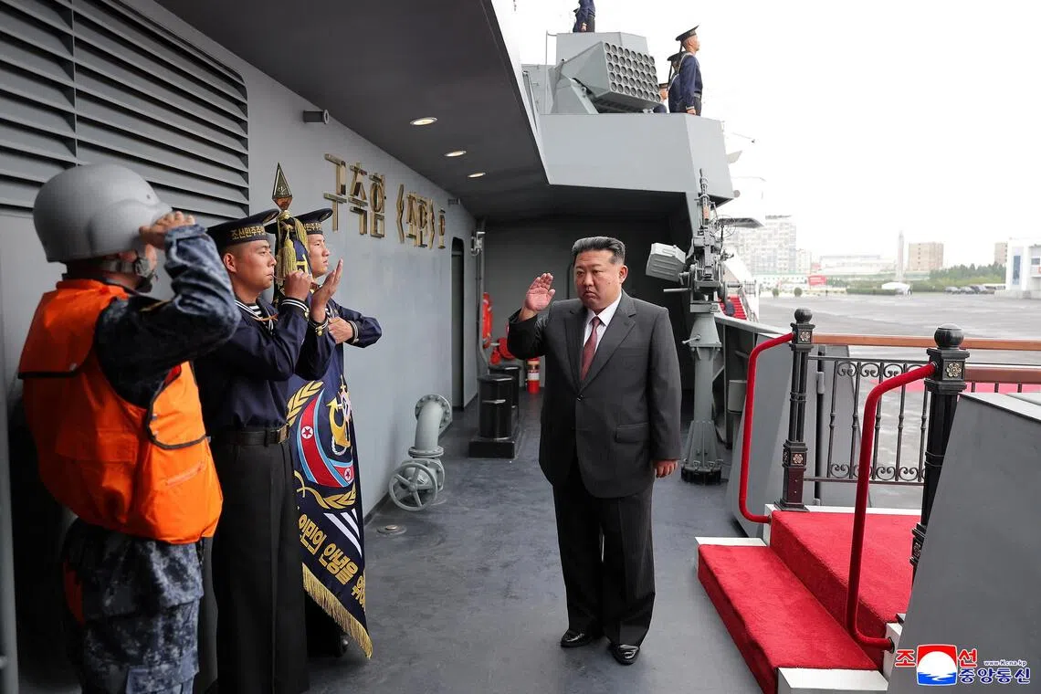 North Korean leader Kim Jong Un visits the Choe Hyon naval destroyer at a military exhibition on Oct 5.