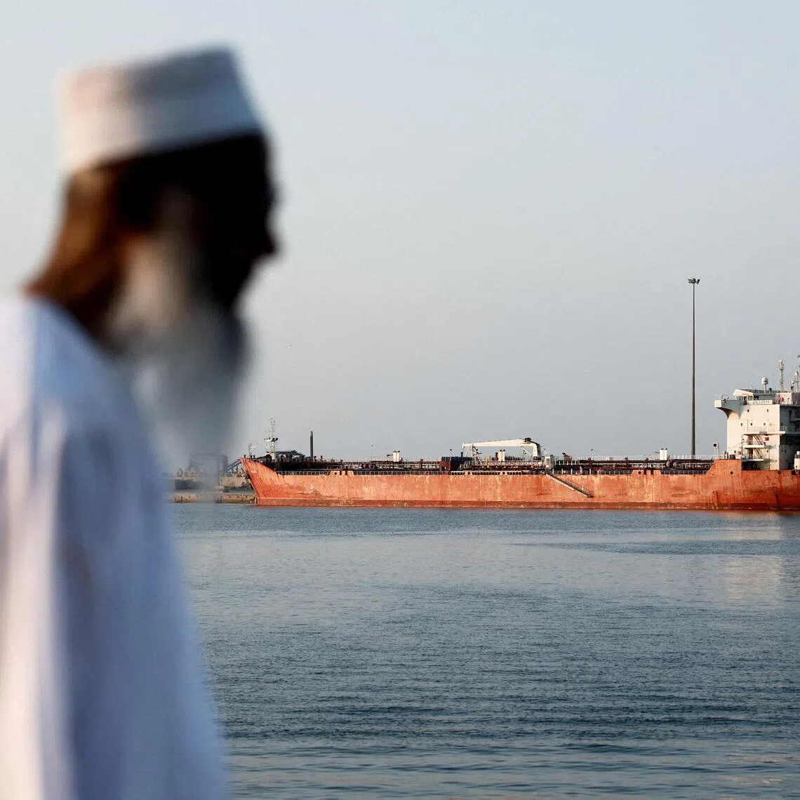 A tanker sits anchored in Muscat, Oman, as the Strait of Hormuz remains essentially shut amid the war in Iran.
