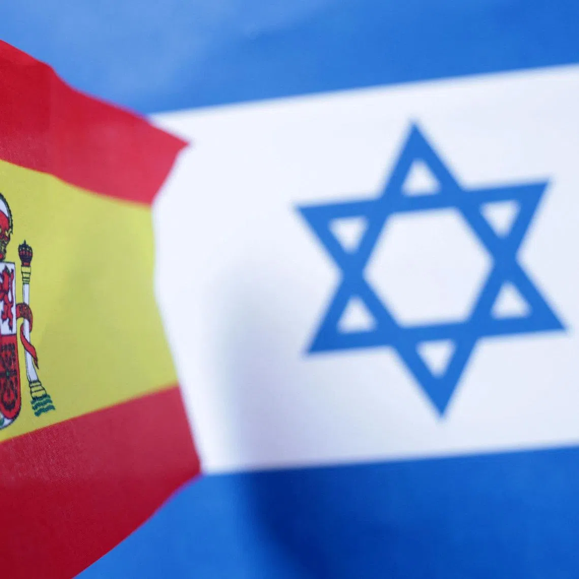 Spanish and Israeli flags are seen in this illustration taken June 23, 2025. REUTERS/Dado Ruvic/Illustration