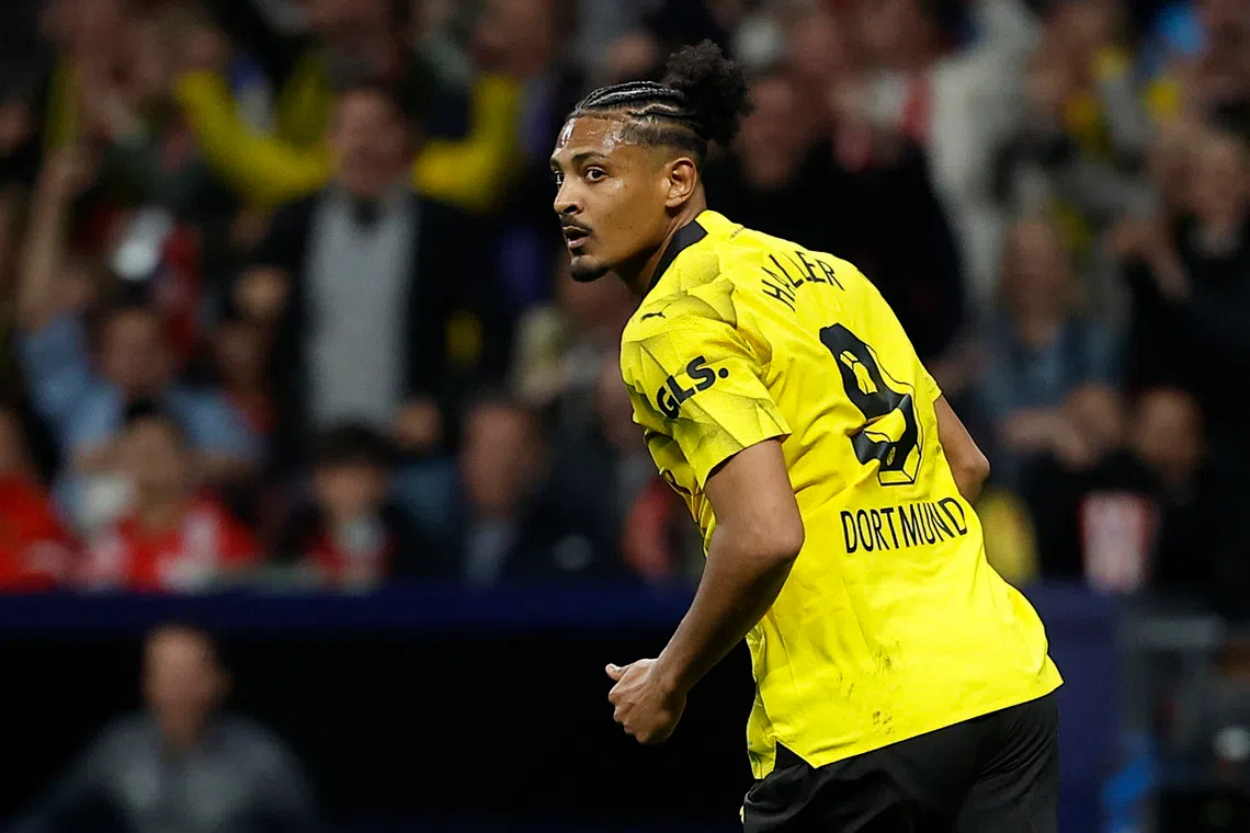 Soccer Football - Champions League - Quarter Final - First Leg - Atletico Madrid v Borussia Dortmund - Metropolitano, Madrid, Spain - April 10, 2024 Borussia Dortmund's Sebastien Haller celebrates scoring their first goal REUTERS/Juan Medina