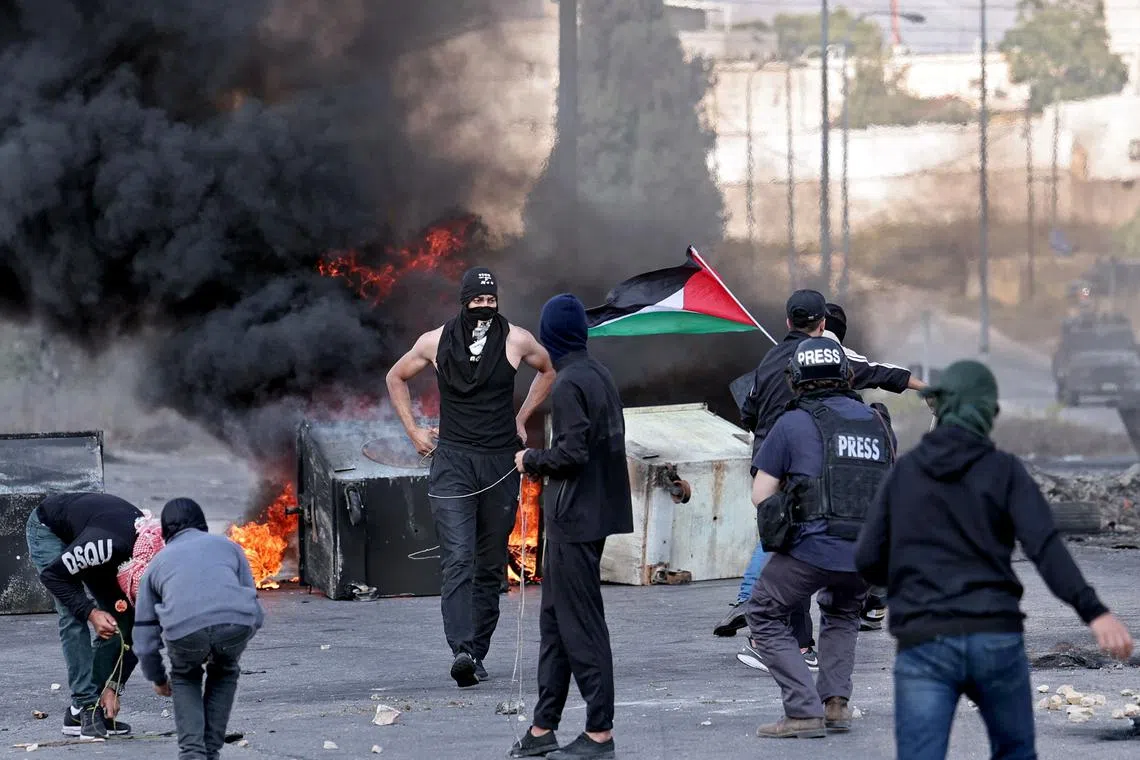 Palestinians during a demonstration in Ramallah, in the occupied West Bank on Oct 18, 2023.
