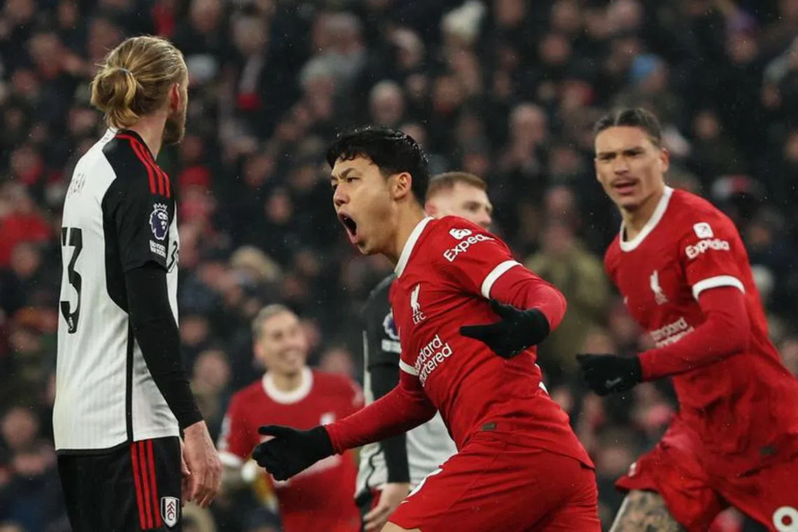Soccer Football - Premier League - Liverpool v Fulham - Anfield, Liverpool, Britain - December 3, 2023 Liverpool's Wataru Endo celebrates scoring their third goal REUTERS/Phil Noble