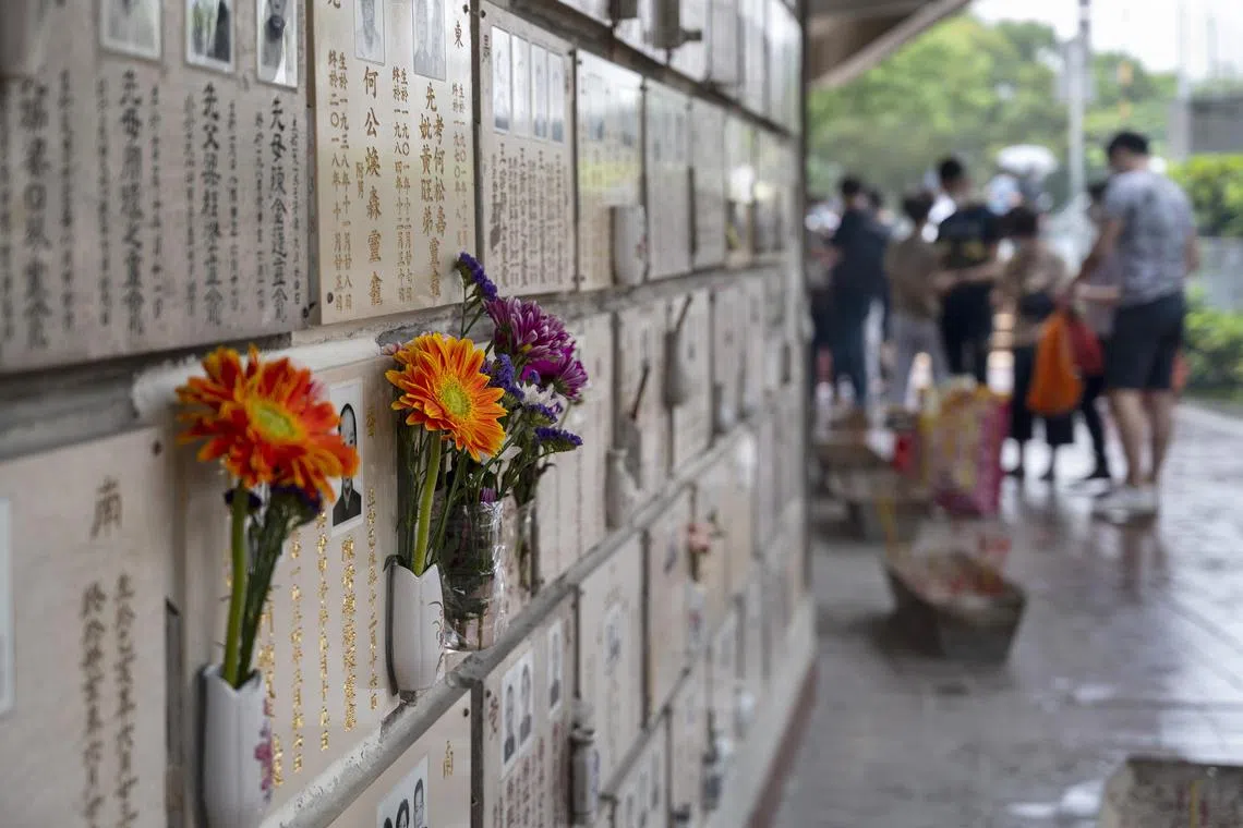 People leave carnations at a columbarium during the Ching Ming Festival in Hong Kong.
The annual Ching Ming Festival, when people visit the graves of deceased relatives and leave offerings in remembrance and respect as the Hong Kong government tries to keep the number of COVID-19 coronavirus infected cases under control while more people get vaccinated.