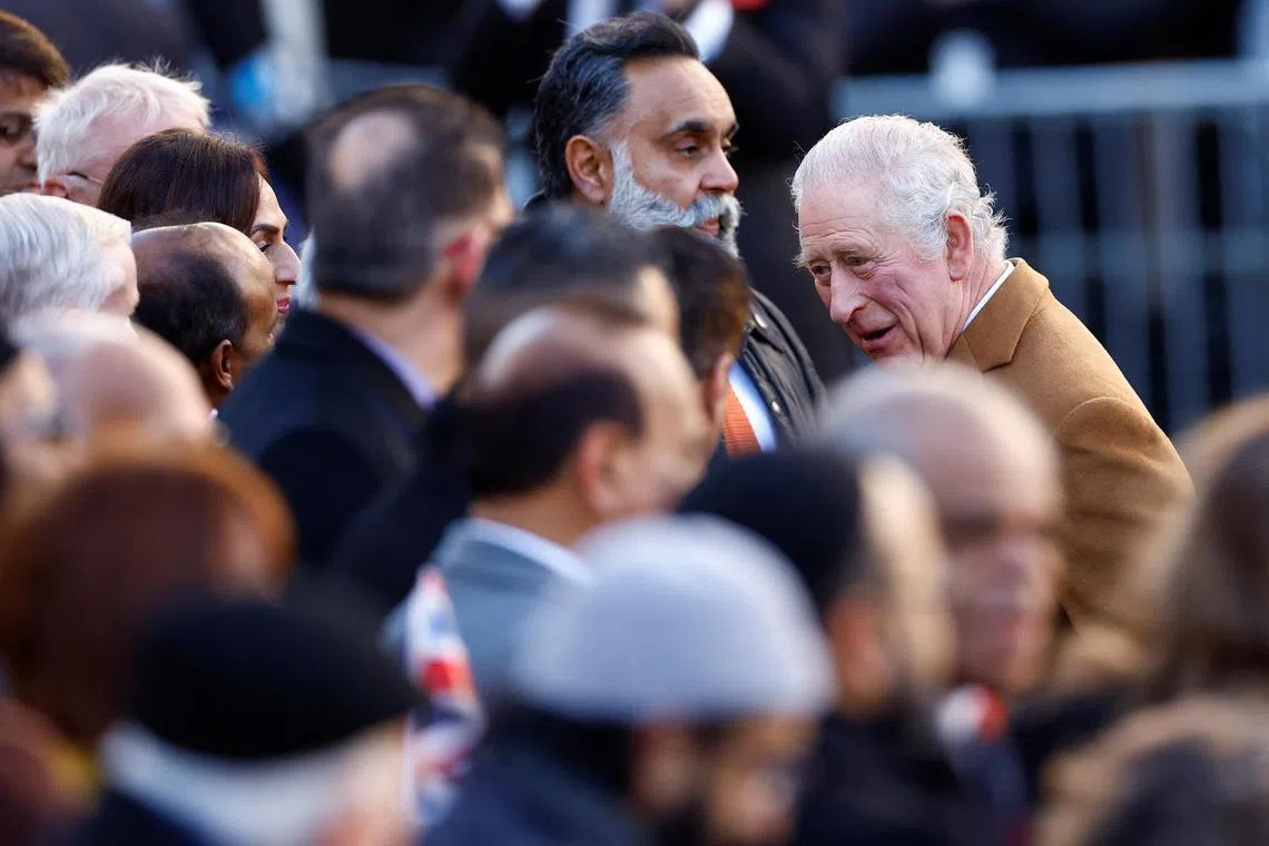 Britain's King Charles III (right) talks to members of the public in Luton, Britain, on Dec 6, 2022.
