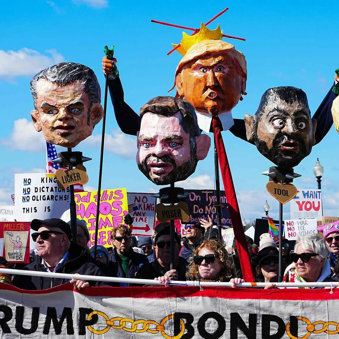 Demonstrators protesting in Washington on March 28 hold effigies of US President Donald Trump and Trump administration officials, during the nationwide "No Kings" day of rallies.
