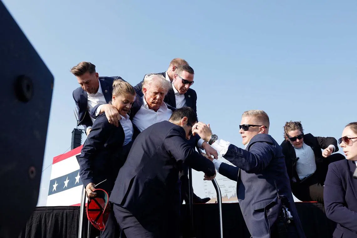 Republican presidential candidate former President Donald Trump is rushed offstage.