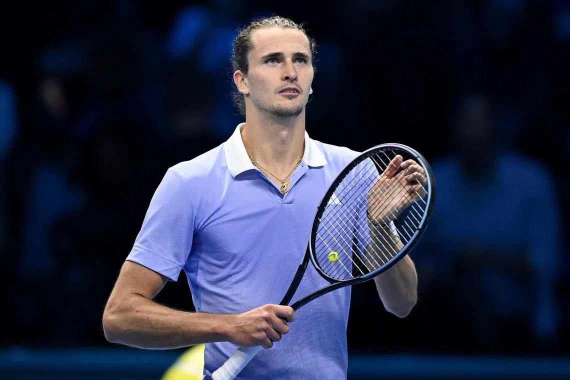 Alexander Zverev of Germany celebrates winning against Casper Ruud of Norway in their group-stage match at the ATP Finals.