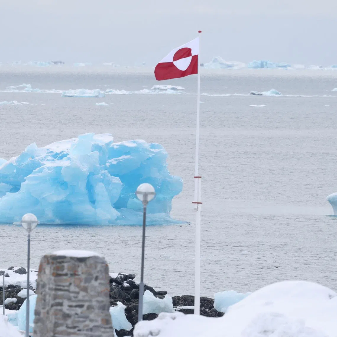 A view of the Greenlandic flag near the beach in Nuuk, Greenland, March 29, 2025. REUTERS/Leonhard Foeger