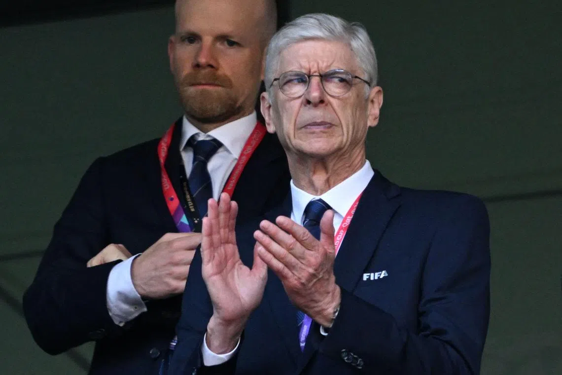 FIFA's Chief of Global Football Development Arsene Wenger applauds ahead of the Qatar 2022 World Cup Group G football match between Switzerland and Cameroon at the Al-Janoub Stadium in Al-Wakrah, south of Doha on November 24, 2022. (Photo by Kirill KUDRYAVTSEV / AFP)