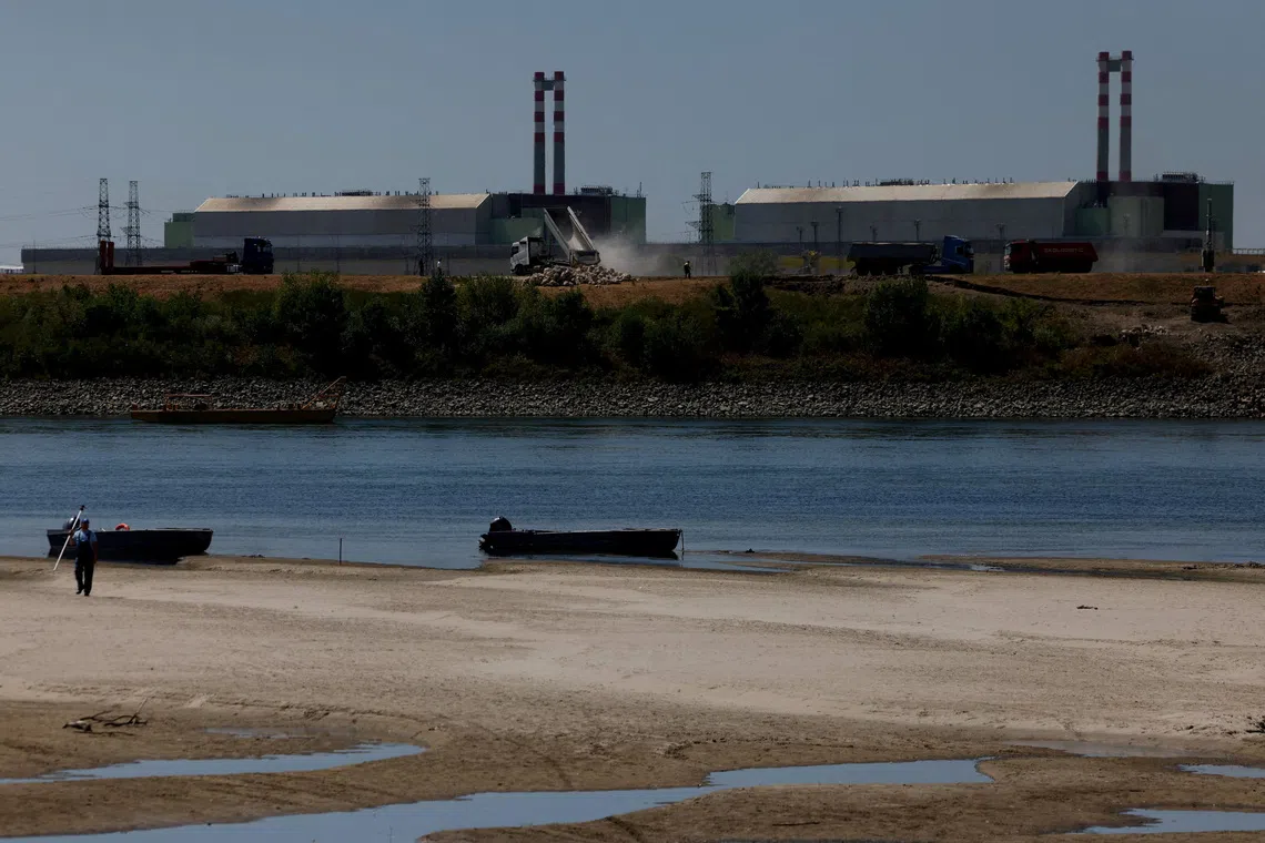 FILE PHOTO: A view of Paks Nuclear Power Plant, as the construction begins on a riverbed sill to raise the Danube's water level in Dunaszentbenedek, Hungary, August 13, 2026. REUTERS/Bernadett Szabo/File Photo