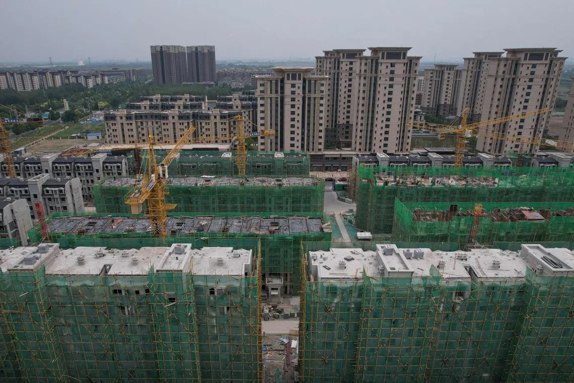 The aerial photo taken on June 5, 2024 shows residential buildings under construction in Tianjin. A year and a half after crippling Covid-19 restrictions ended, the property crisis is just one of the deadweights dragging on China's recovery momentum, sending ripples of unease through the country's leaders and citizens. (Photo by Jade GAO / AFP) / To go with 'CHINA-ECONOMY-POLITICS, FOCUS' by Peter Catterall, and Rebecca Bailey in Shanghai