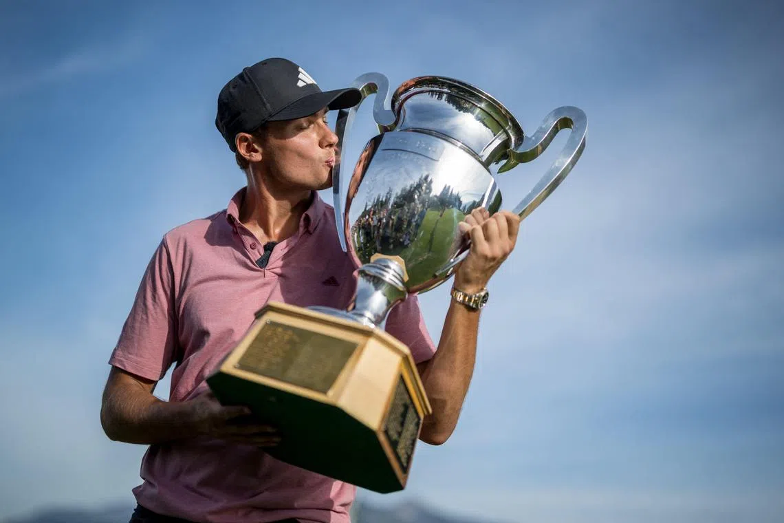 Sweden's Ludvig Aberg kissing the trophy after winning the European Tour's European Masters golf tournament in Crans-Montana, western Switzerland on Sunday.