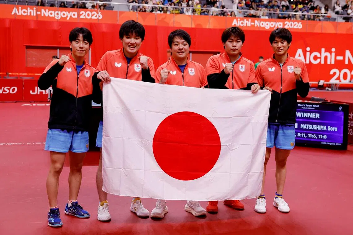 Japan’s (from left) Tomokazu Harimoto, Sora Matsushima, Shunsuke Togami and reserves Yukiya Uda and Hiroto Shinozuka celebrate winning Asian Games men’s team table tennis gold on Sept 24.