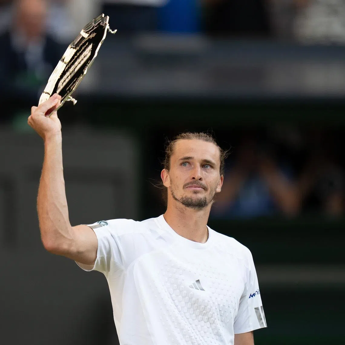 Jul 12, 2026; London, United Kingdom; Alexander Zverev of Germany holds up the finalist trophy after the men’s singles final against Jannik Sinner of Italy on day 14 at All England Lawn Tennis and Croquet Club.  Mandatory Credit: Susan Mullane-Imagn Images