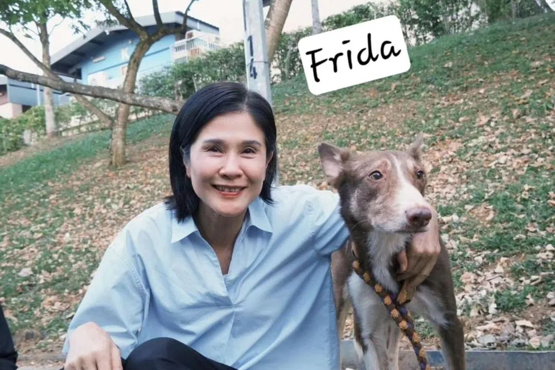 Lin Meijiao with the dog which plays Frida. 