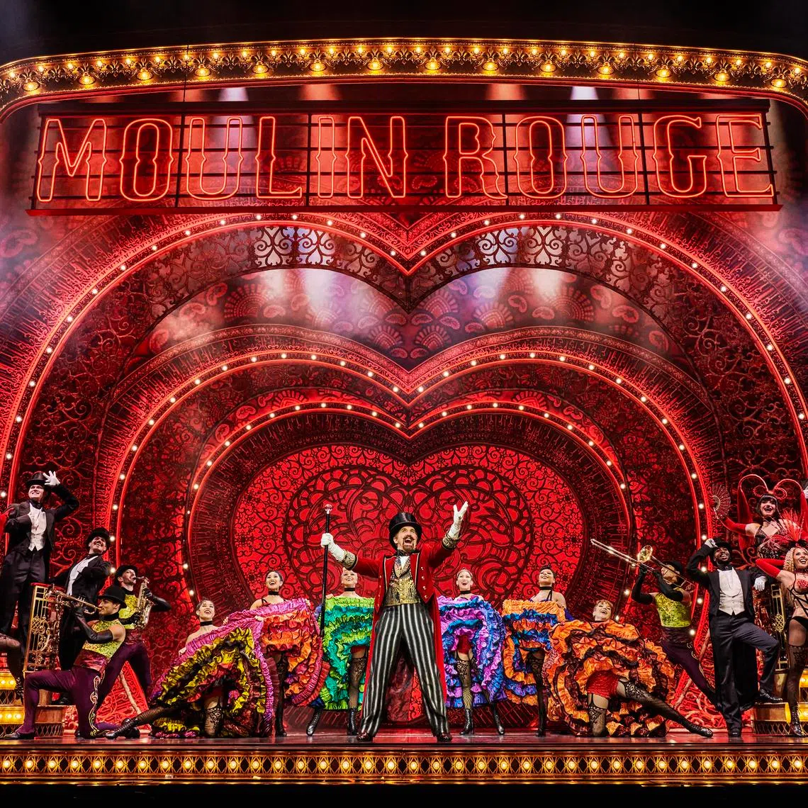 Cameron Blakely as Harold Zidler and the original world tour company of
 Moulin Rouge! The Musical