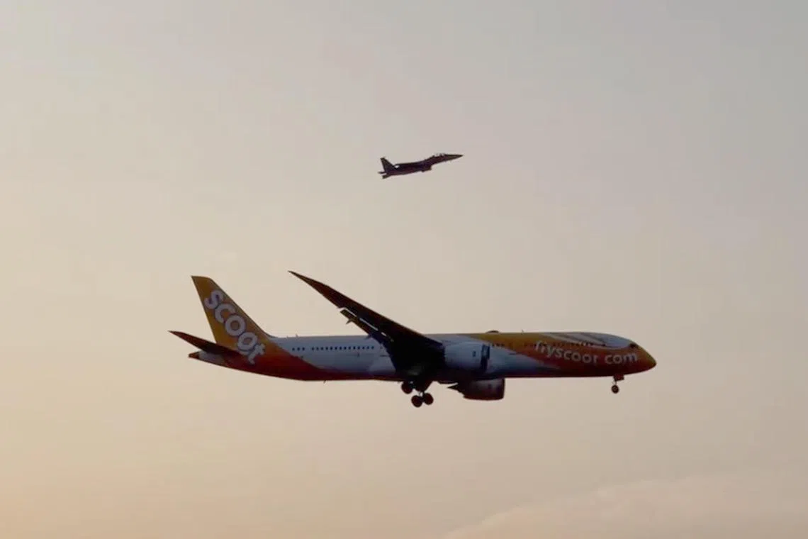 One of two RSAF fighter jets escorting Scoot flight TR16 back to Changi Airport on Thursday.