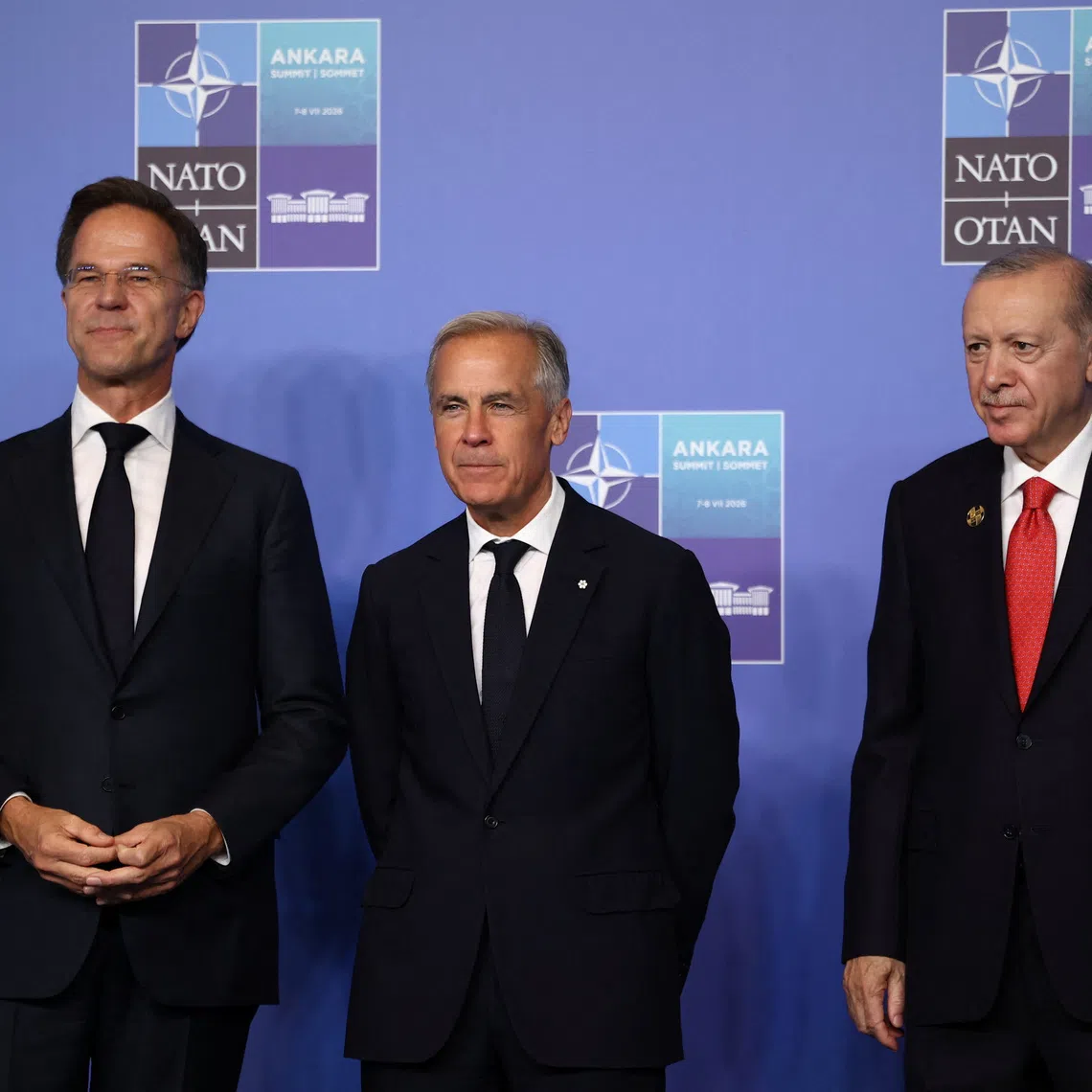 Turkish President Tayyip Erdogan and NATO Secretary General Mark Rutte welcome Canadian Prime Minister Mark Carney at a NATO leaders' summit in Ankara, Turkey, July 8, 2026. REUTERS/Stoyan Nenov