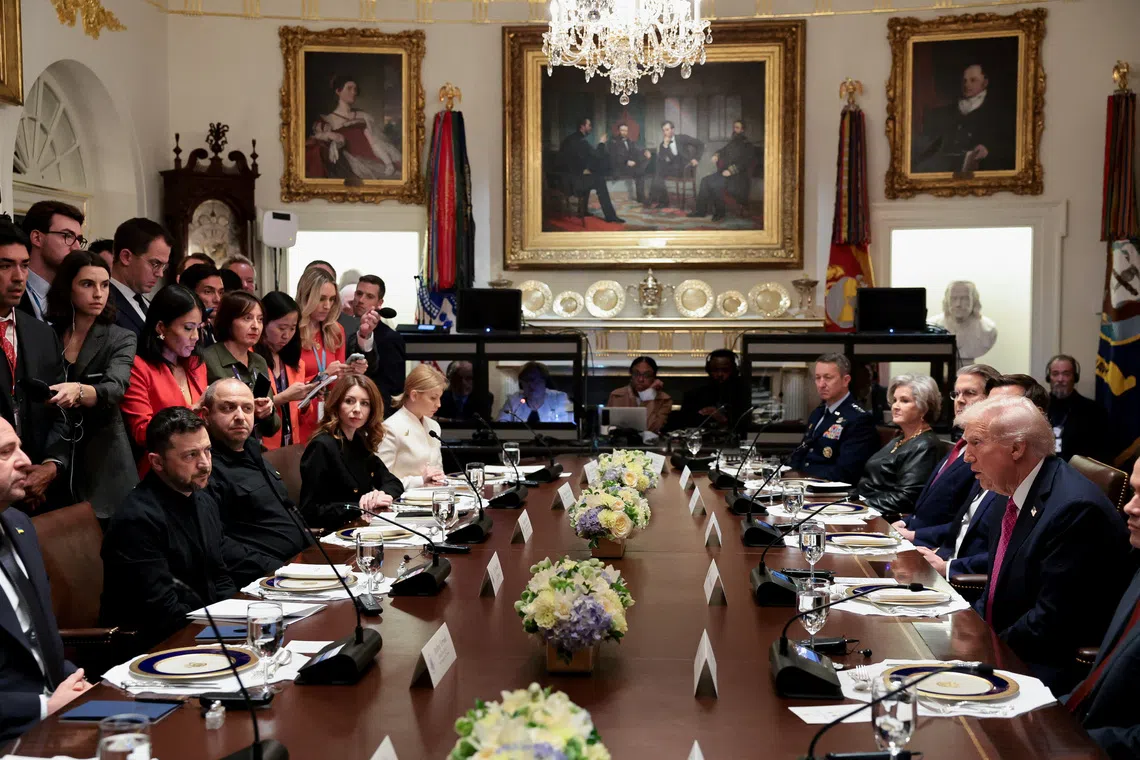 U.S. President Donald Trump meets with Ukraine's President Volodymyr Zelenskiy over lunch in the Cabinet Room at the White House in Washington, D.C., U.S., October 17, 2025. REUTERS/Jonathan Ernst