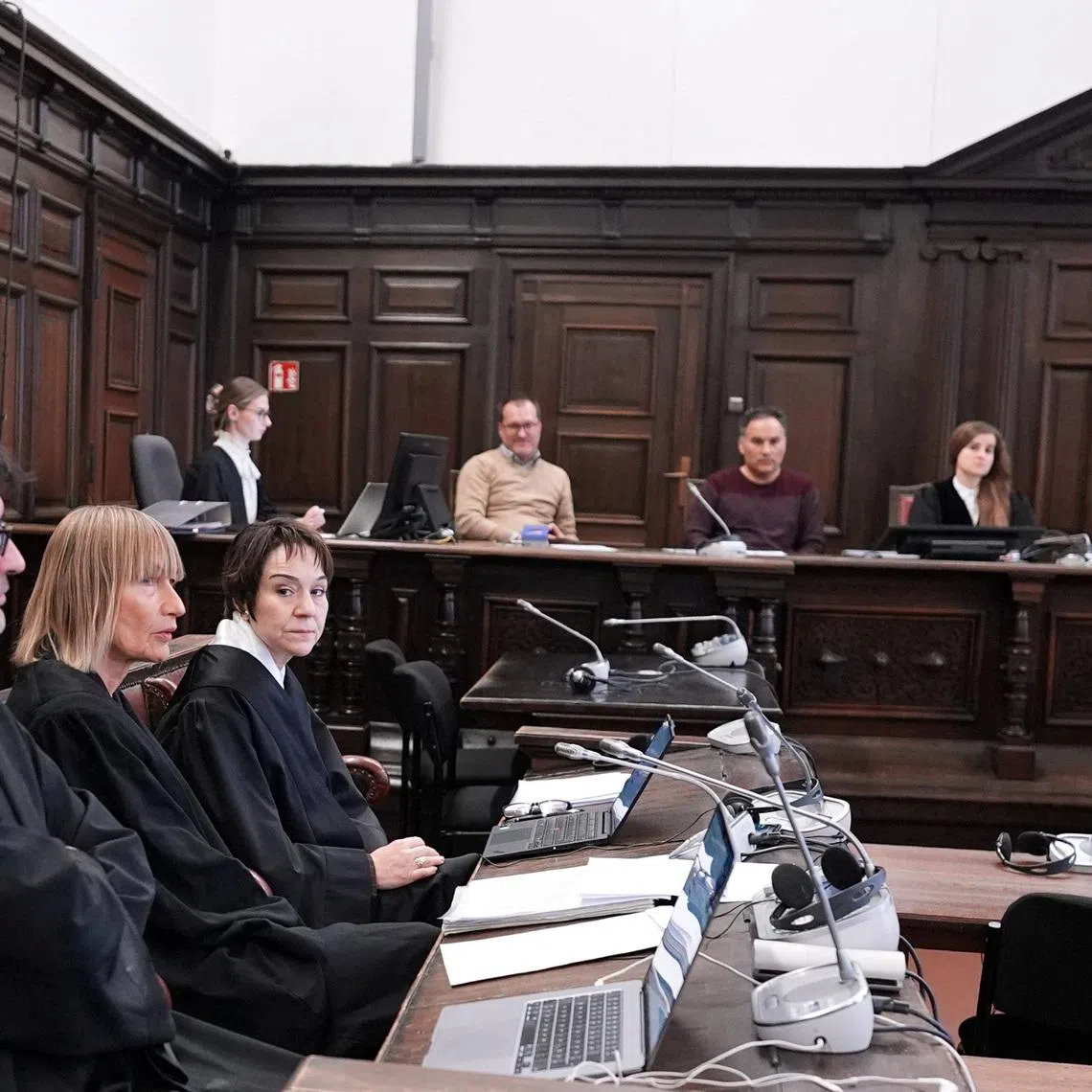 Lawyer Christiane Yueksel, defense lawyer of the accused and Christiane Berger, lawyer and defense lawyer for the accused wait in the courtroom before the start of the so called \"White Tiger\" trial in Hamburg, Germany, January 9, 2026. The trial against a 21-year-old man who allegedly used the online pseudonym \"White Tiger,“ is accused of forcing children and teenagers to self-harm and commit sexual acts online, leading to a 13-year-old boy taking his own life in the United States, began behind closed doors in Hamburg on Friday. The trial - which is being held in private due to the age and vulnerability of the victims - marks a precedent in Germany as the first time someone has gone on trial for murder in a suicide that occurred in a different jurisdiction.     Marcus Brandt/Pool via REUTERS