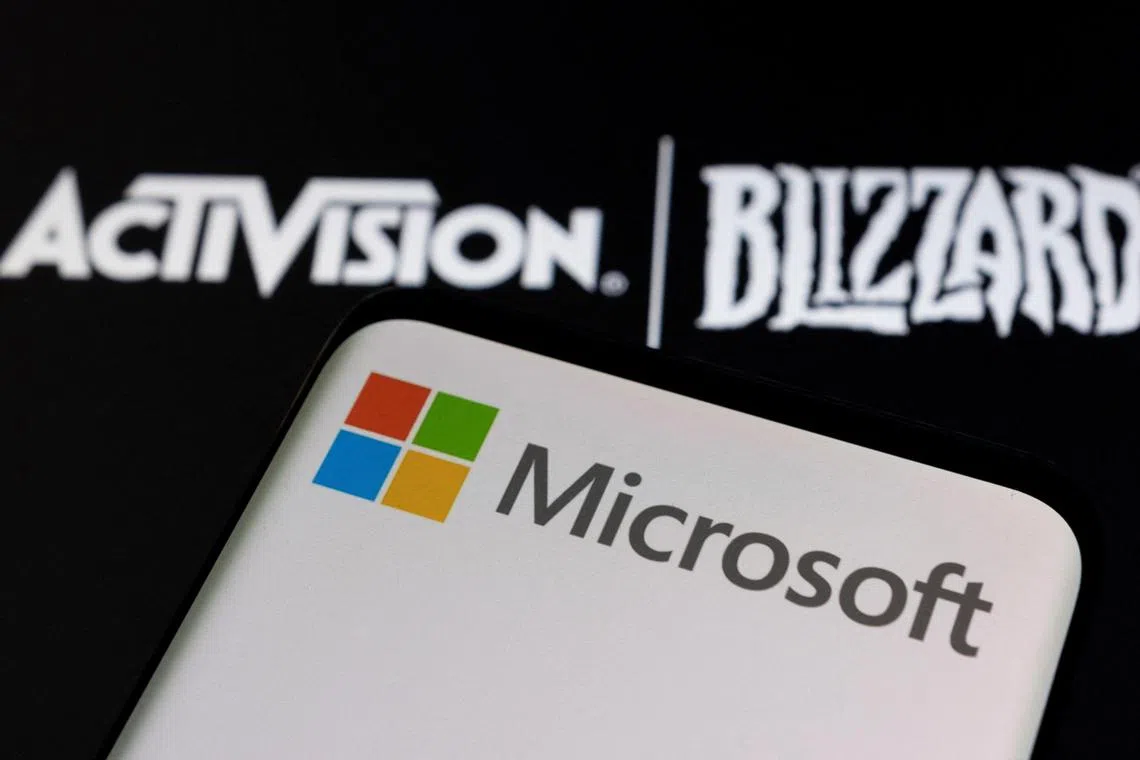 FILE PHOTO: Microsoft logo is seen on a smartphone placed on displayed Activision Blizzard logo in this illustration taken January 18, 2022. REUTERS/Dado Ruvic/Illustration/File Photo