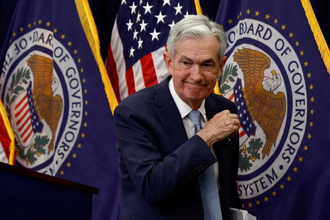 Federal Reserve Board Chairman Jerome Powell leaves after a news conference in Washington. 