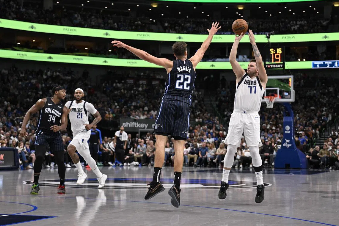 Dallas Mavericks guard Luka Doncic (No. 77) making a three pointer against the Orlando Magic at the American Airlines Centre. The Mavs won the National Basketball Association clash 108-85 on Nov 3.