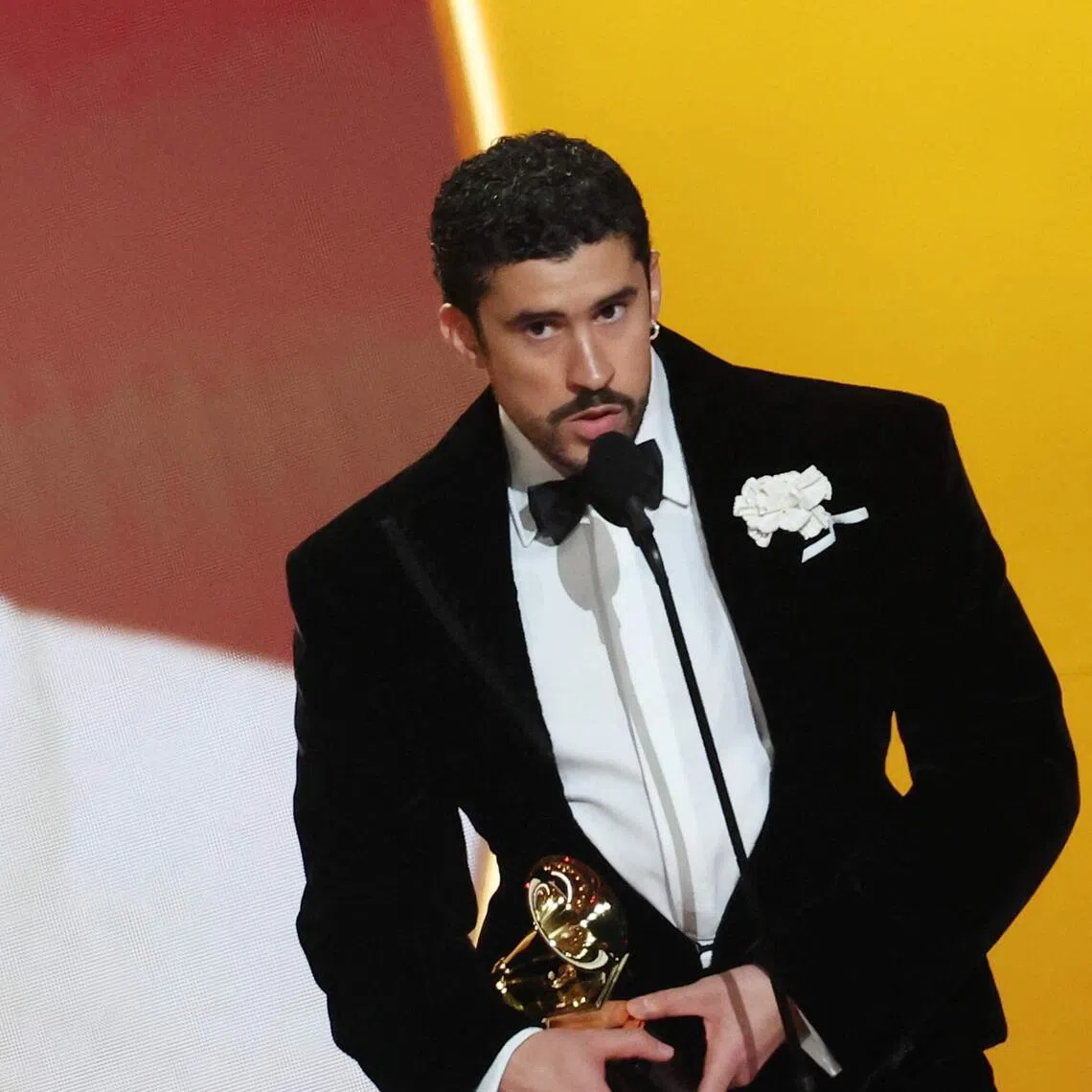 Bad Bunny accepts the Best Musica Urbana Album award for Debi Tirar Mas Fotos onstage during the 68th Grammy Awards on Feb 1.