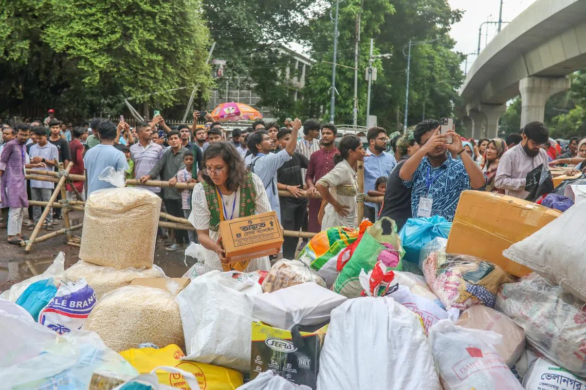 Bangladeshis have been crowdfunding relief efforts and helping to load rice sacks and crates of bottled water onto vehicles for areas affected by the deluge.